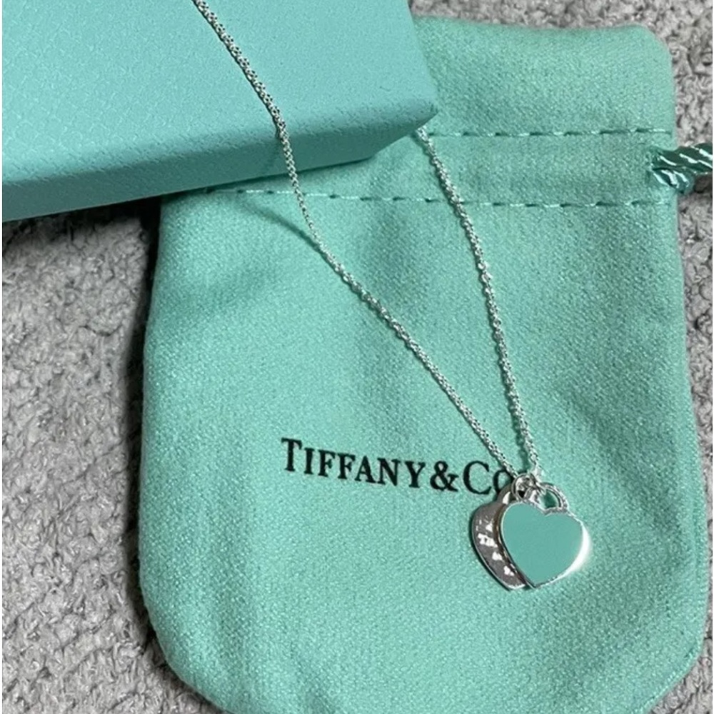 Tiffany & Co. necklace with blue charm and silver charm #66